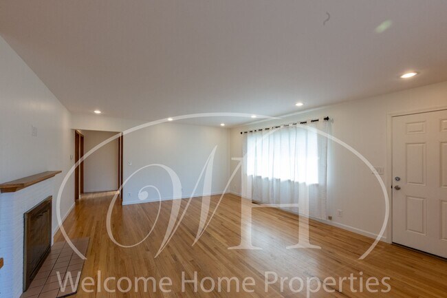 Building Photo - Spacious 5 Bedroom Home with Fenced Yard & Covered Parking