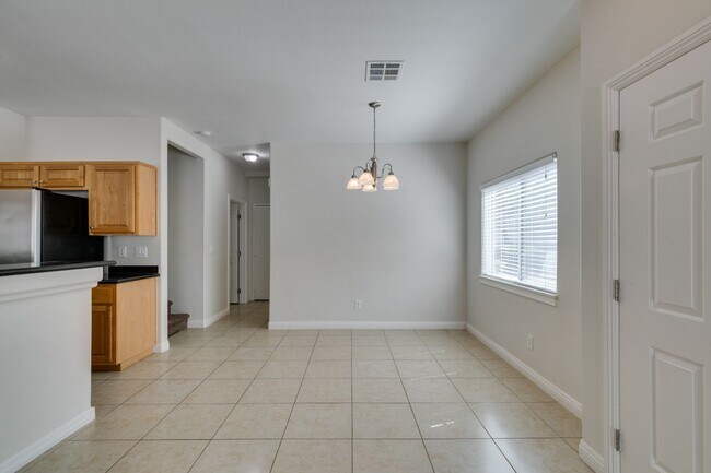 Building Photo - Great townhome in Henderson Gated Community with a 2 car attached garage and backyard