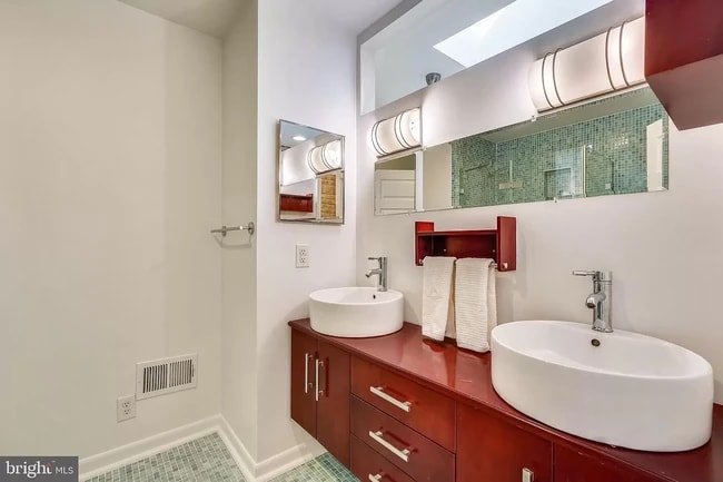 Upstairs bathroom with his and her sinks and shower - 122 N Bradford St