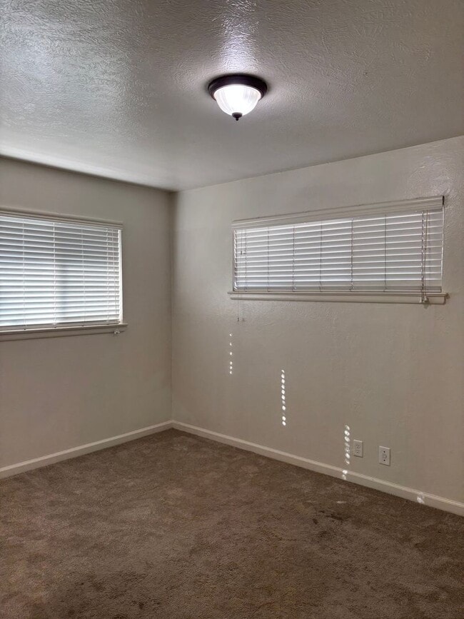 Building Photo - Updated 3 bedroom 2 bathroom home with large backyard, corner lot, close to shopping and schools ...