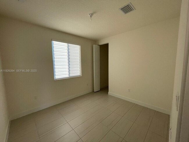 Building Photo - 6416 NW 102nd Ct