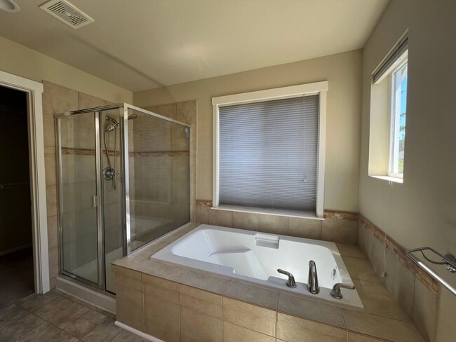Building Photo - Spacious 4 Bedroom Home with Zen Backyard and 3-Car Garage