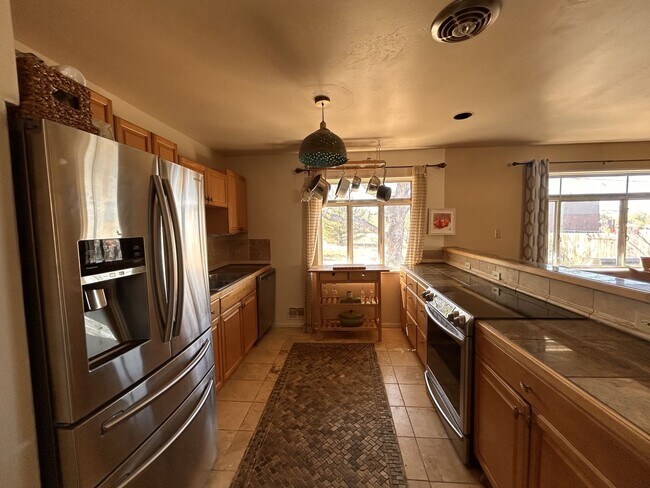 Building Photo - Enjoy Amazing Flatiron Views, Abundant Space, and A Large Backyard in this 5 Bedroom Home