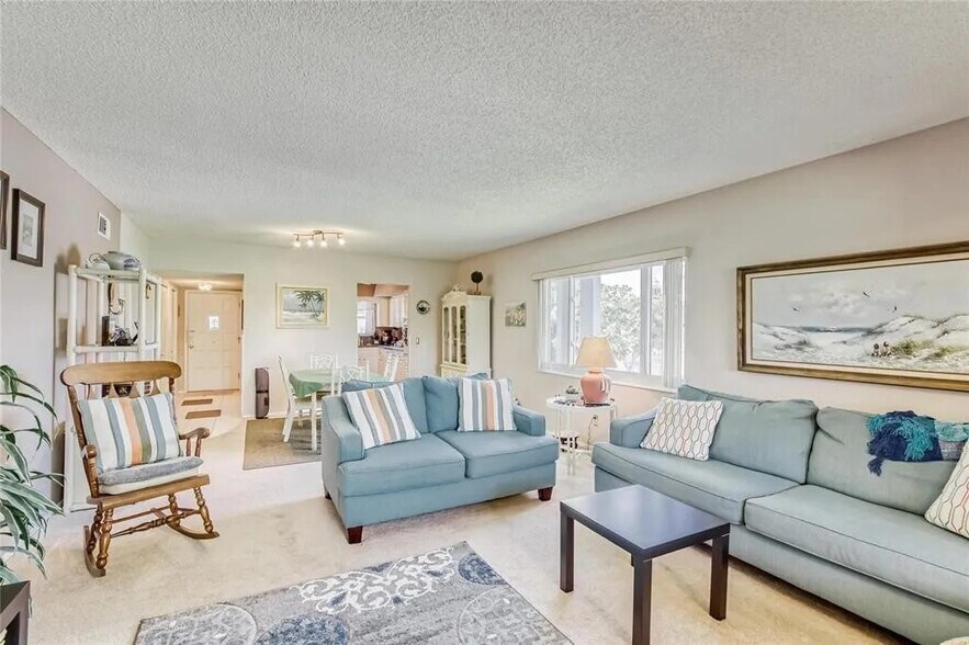 Living room looking towards dining area and kitchen - 2460 Franciscan Dr