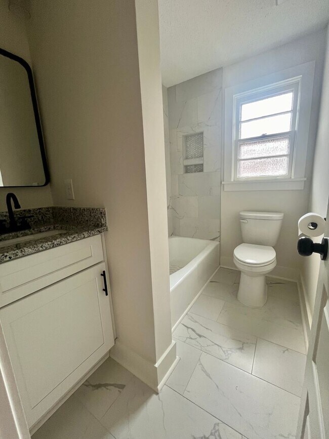 Building Photo - Fully Renovated 3BR/1.5BA – Prime Location + Lawn Care Included