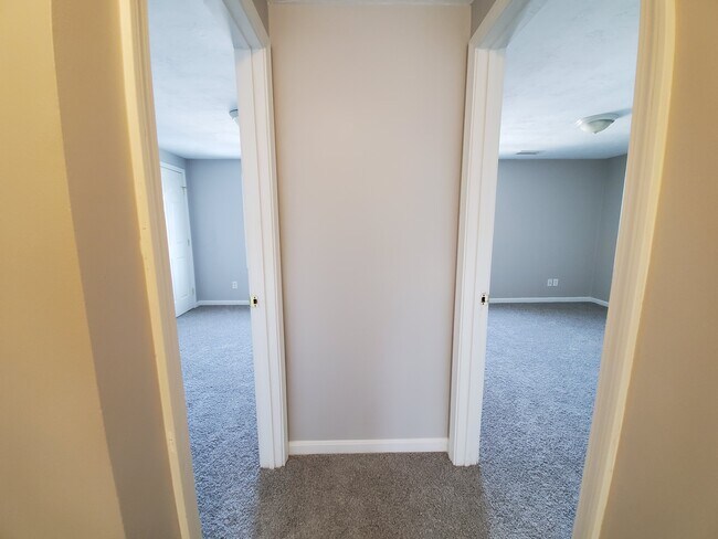 Upstairs hall between bedrooms. Bedroom 2 on right and 3 on left with 1 Behind Camera. - 1 Rosamond St