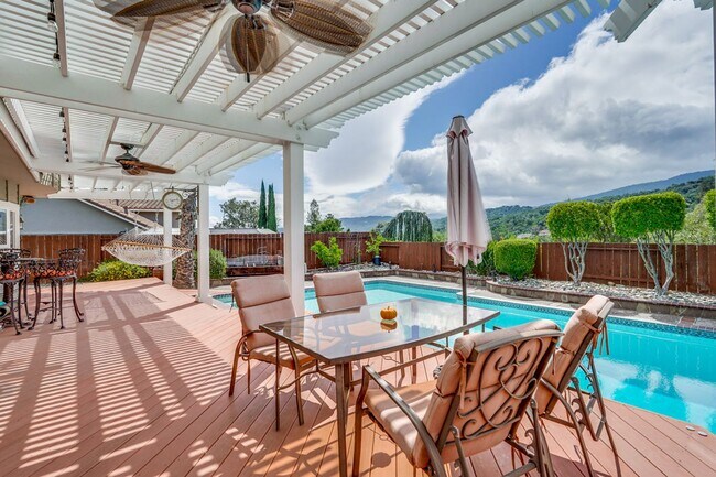 Building Photo - Remodeled 5 Bedroom Home with Heated Pool, Hillside Views, Solar, and Sunrise and Sunset Views in...
