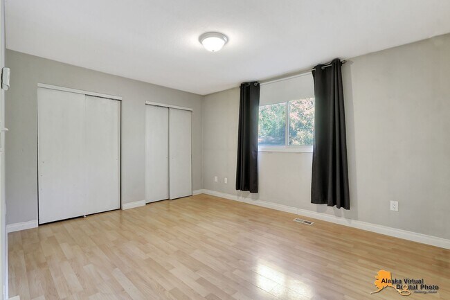 Building Photo - Eagle River Home w/ Fenced Yard, Sunroom, and Garage!