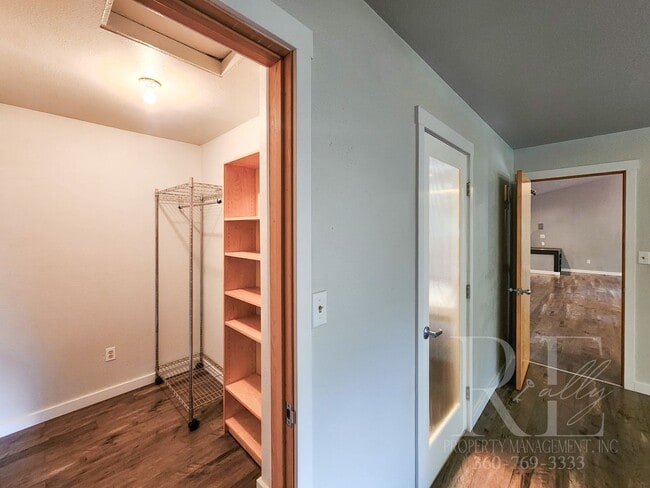 Building Photo - Vaulted Ceilings, Unique Designer Kitchen & Expansive Half-Acre Setting with Flexible Living Spaces
