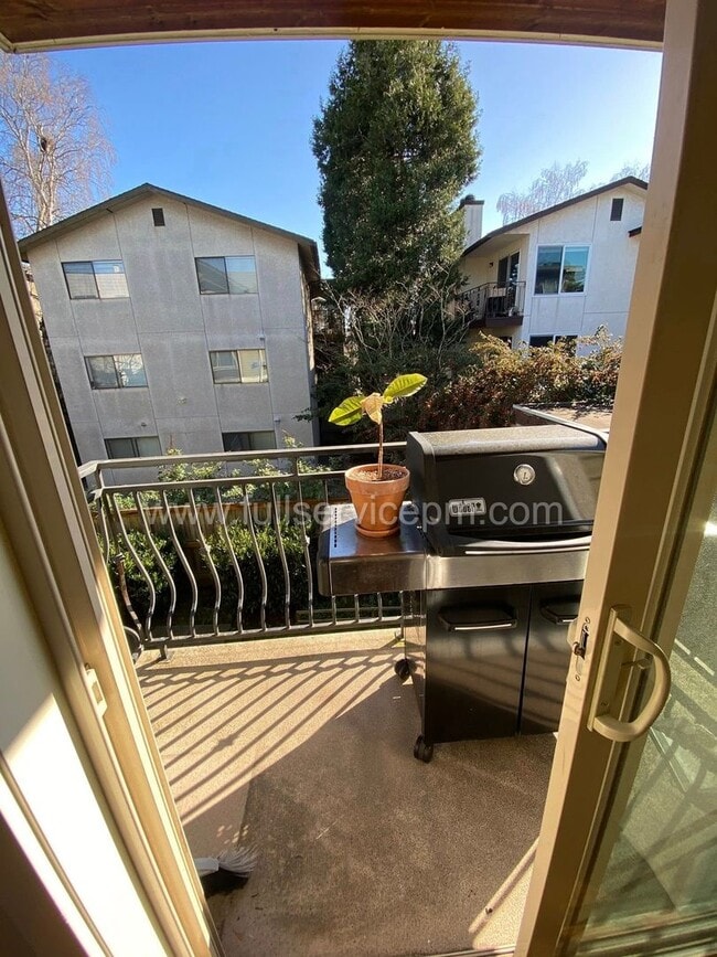 Building Photo - Spacious townhome with private backyard, garage parking, multiple decks, and a dedicated home off...