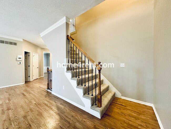 Building Photo - Updated Kitchen, Large Two Tiered Deck, Finished Basement in Blue Valley Schools!