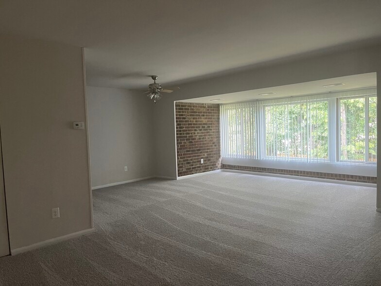 Living room, dining room, and sunroom - Skyview Apartments