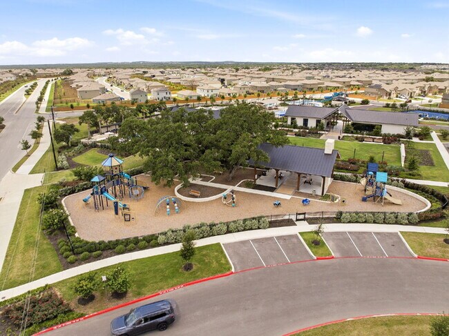 Building Photo - RESORT STYLE AMENITIES!! Multiple Pools. Lazy River. Splash Pad and Water Slides. Fitness Center....