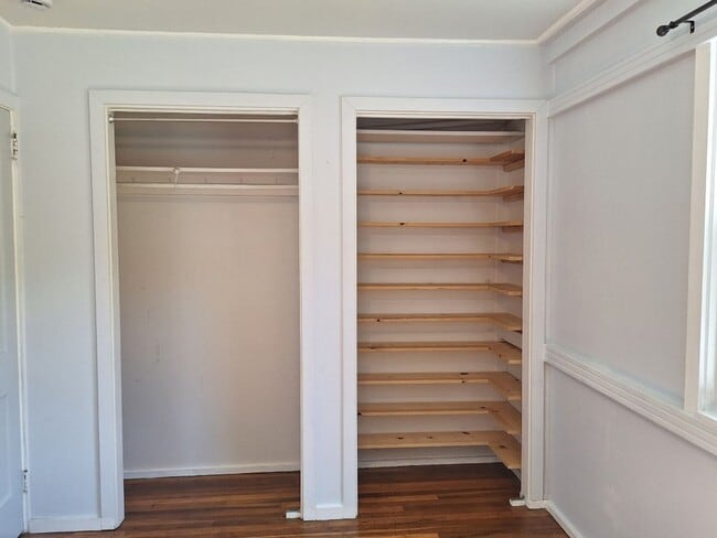 Building Photo - Cute white cottage with white picket fence & Huge deck off back door!