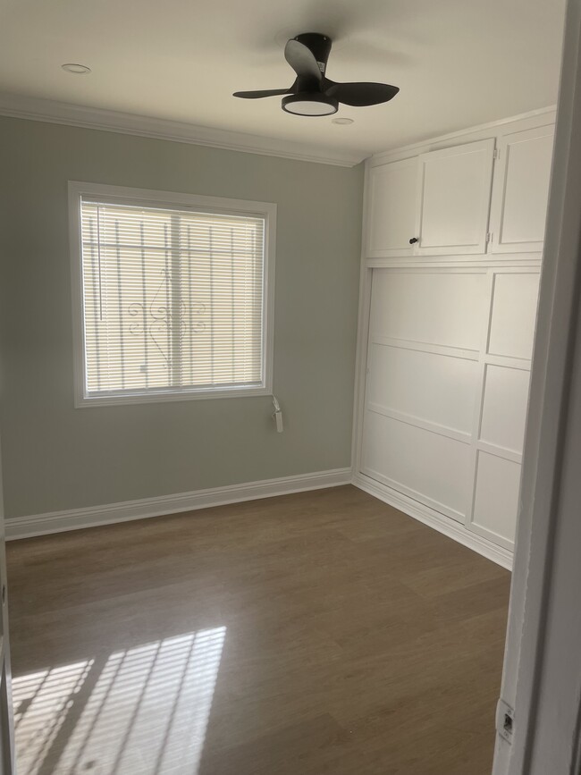 new vinyl plank flooring, plenty of closet space - 7736 Whitsett Ave