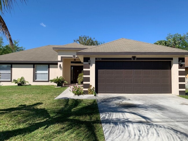 Building Photo - 4 Bedroom 2 bath CBS House with 2 car garage
