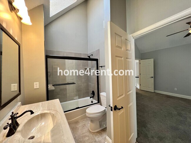 Building Photo - Maintenance Free Living w/ Hardwood Floors, Open Layout, Granite Counters, Finished Basement!