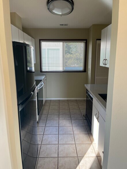 Kitchen looking towards rear window (above carport) - 7511 N Edgewater Ave