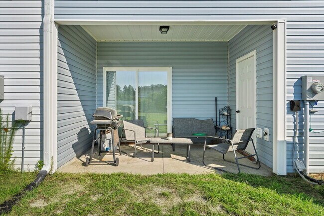 Building Photo - Available Now! Enjoy low-maintenance coastal living in this beautiful 2-bedroom, 2.5-bath townhom...