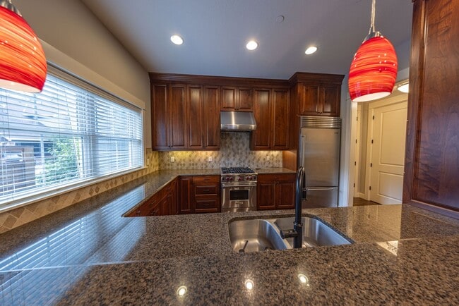 Building Photo - 2 Creeks Condominiums - Gated Community on...