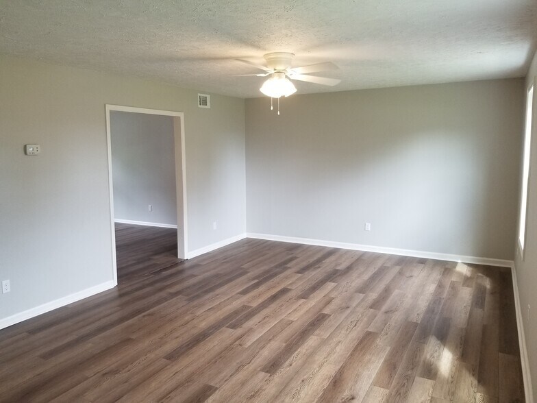 Living room (near front door) looking at living area and dining room past doorway. - 1445 Toshiba Drive, #B