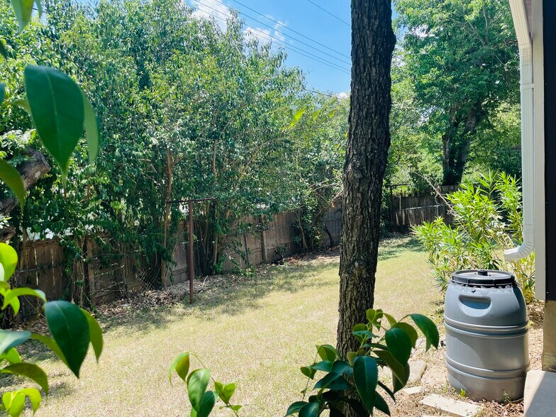peaceful backyard with privacy trees - 6717 Tulsa Cove