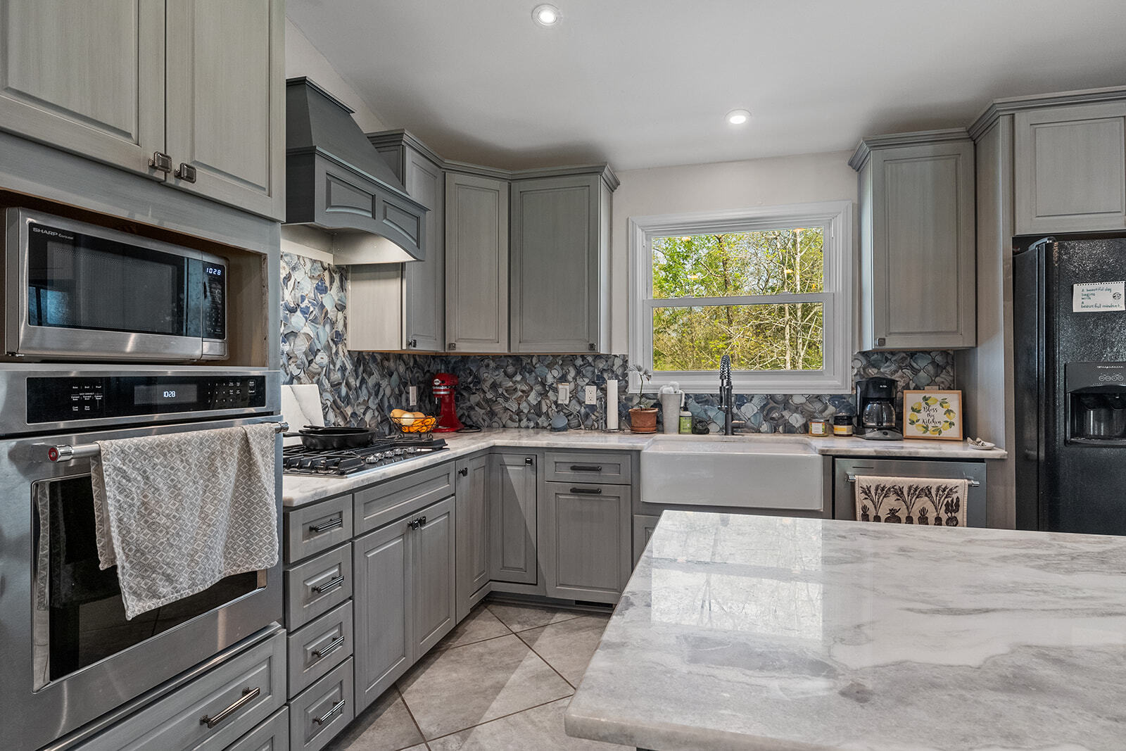 Kitchen with soft close cabinets, newer appliances, and gas range. - 358 Twin Oaks Dr