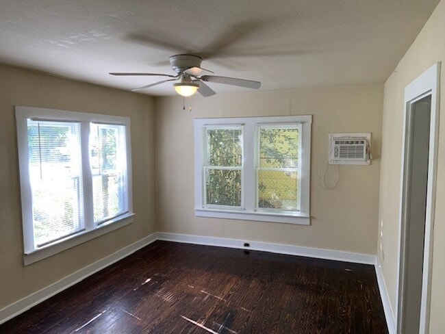 Building Photo - *COMING SOON* Charming Cottage Retreat with Fenced Yard!