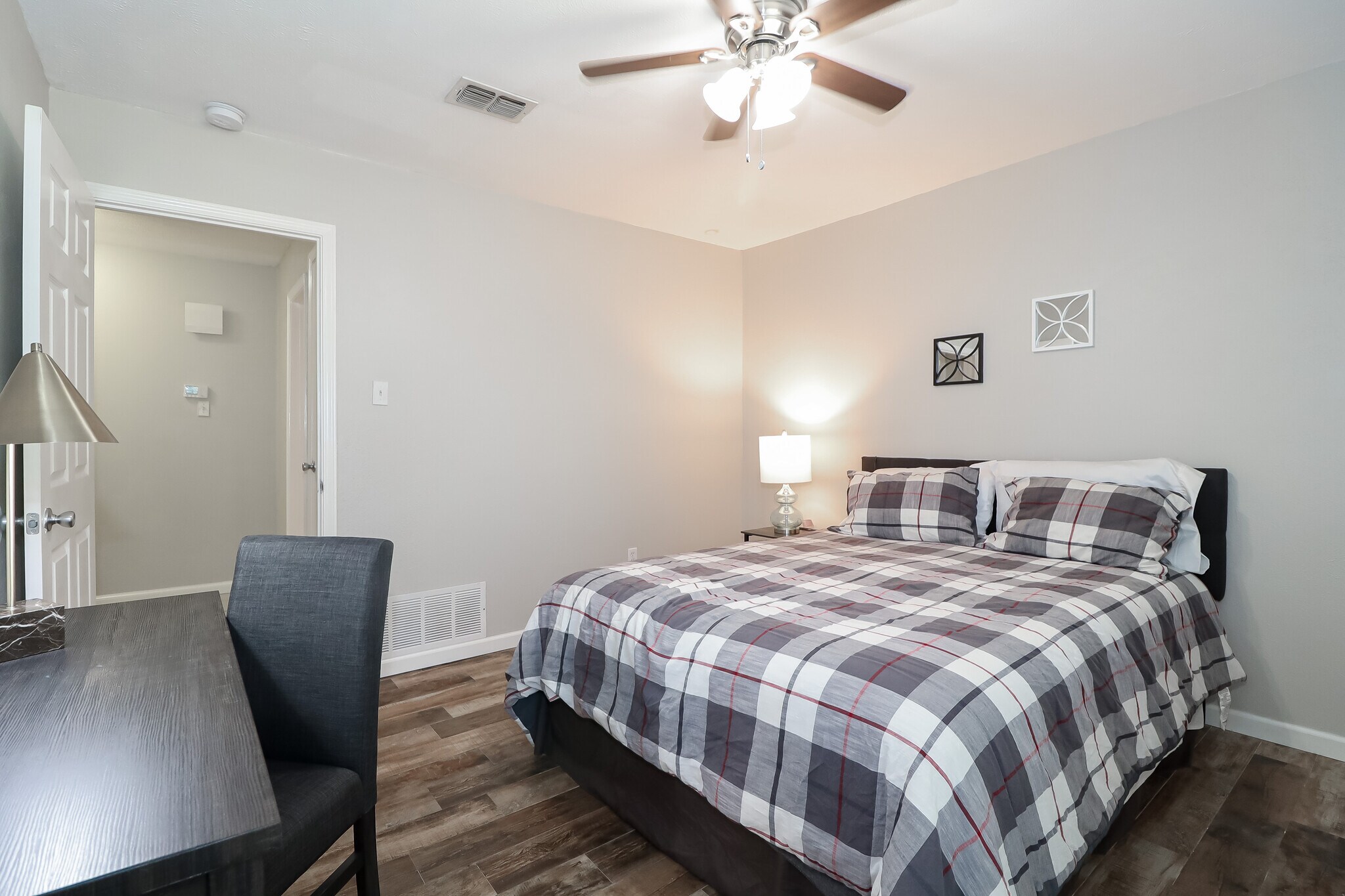 This room also features a walk-in closet with a small chest of drawers. - 2507 Holt Road