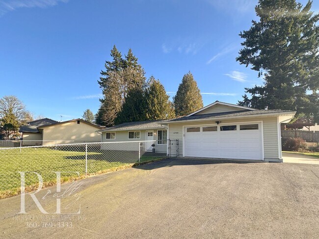 Building Photo - A Warm & Welcoming Rambler in the Heart of Central Kitsap
