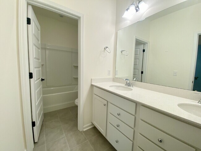 Building Photo - Four Bedroom Single Family Home in The Lak...