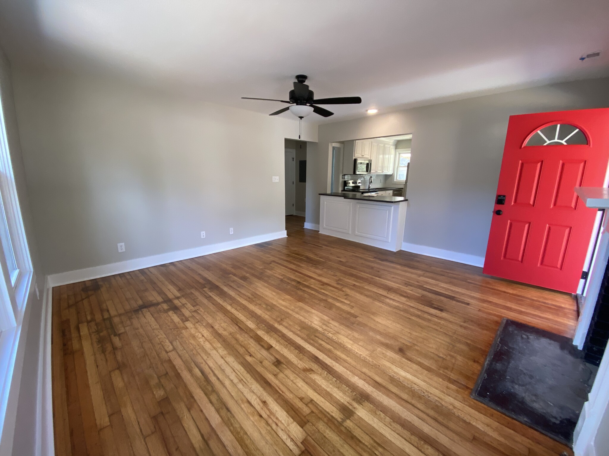 Spacious open concept living area, refinished original hardwoods, ceiling fans neutral palette - 1524 Ward Ave NE