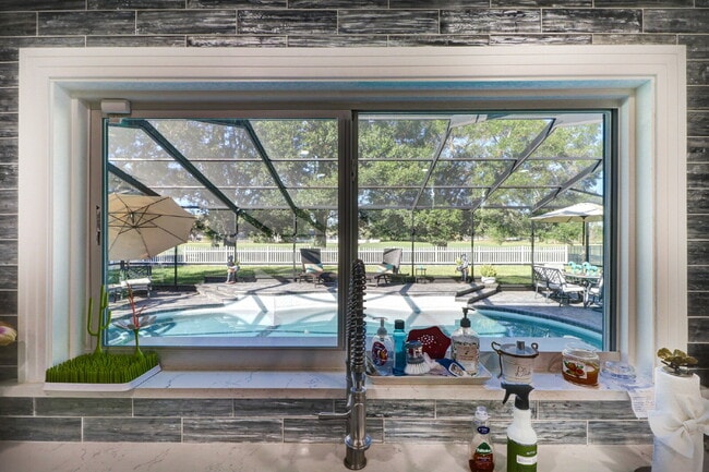 Building Photo - Fully Furnished 4-Bedroom Pool Home with Golf Course Views in Northdale