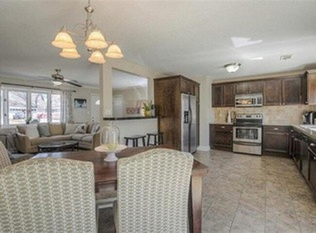 Building Photo - {5611} Updated OP Ranch + Two Car Garage + Fenced Yard and Stamped Concrete Patio Perfect for Spr...