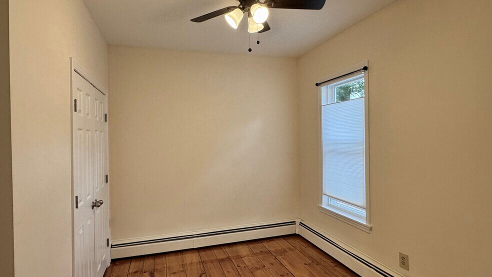Bedroom w pine floors & ceiling fan, double closet - 21 Liberty St