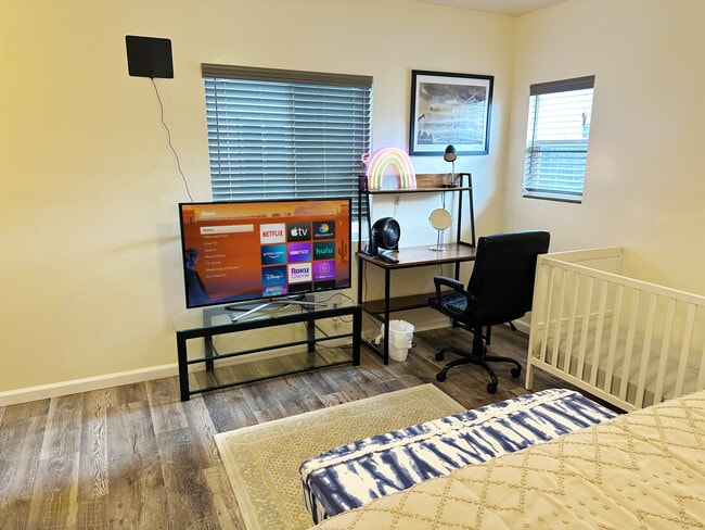 Watch shows or get plenty of work done in this workspace w/ an ergonomic chair & office table - 1738 Dahlia Ave
