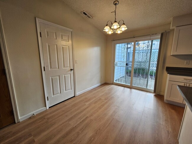 Building Photo - Charming Single-Level Home Featuring New Hardwood Floors, Bright Bedrooms & Open-Concept Living