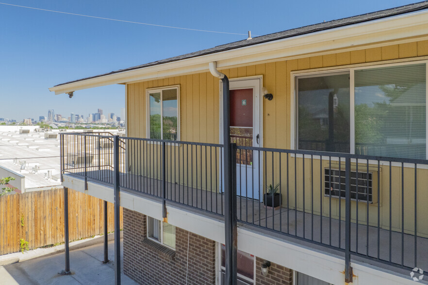 The Powderhorn Apartments with a skyline view - Powderhorn Apartments