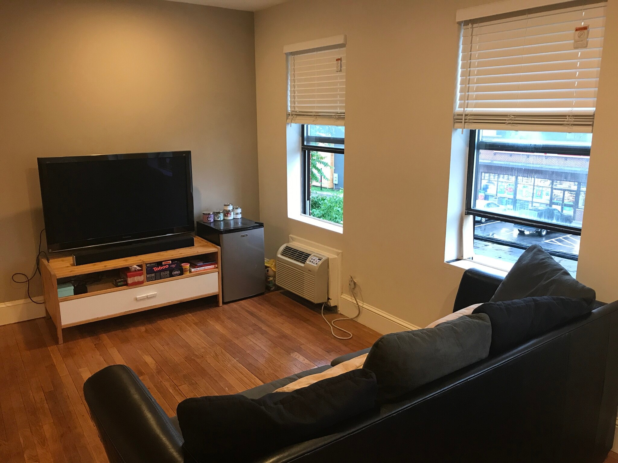 Open floor plan- furnished living room with sofa and entertainment center - 3719 12th St NE