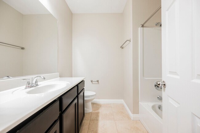 Building Photo - Single Story w/ duel primary suites gated ...