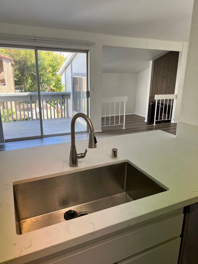 Building Photo - Upstairs Studio Condo in Huntington Harbor...