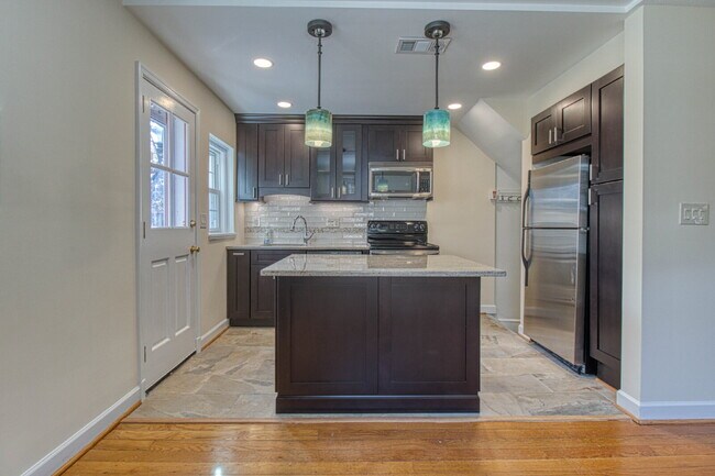 Building Photo - Discover Exceptional Townhouse Living!