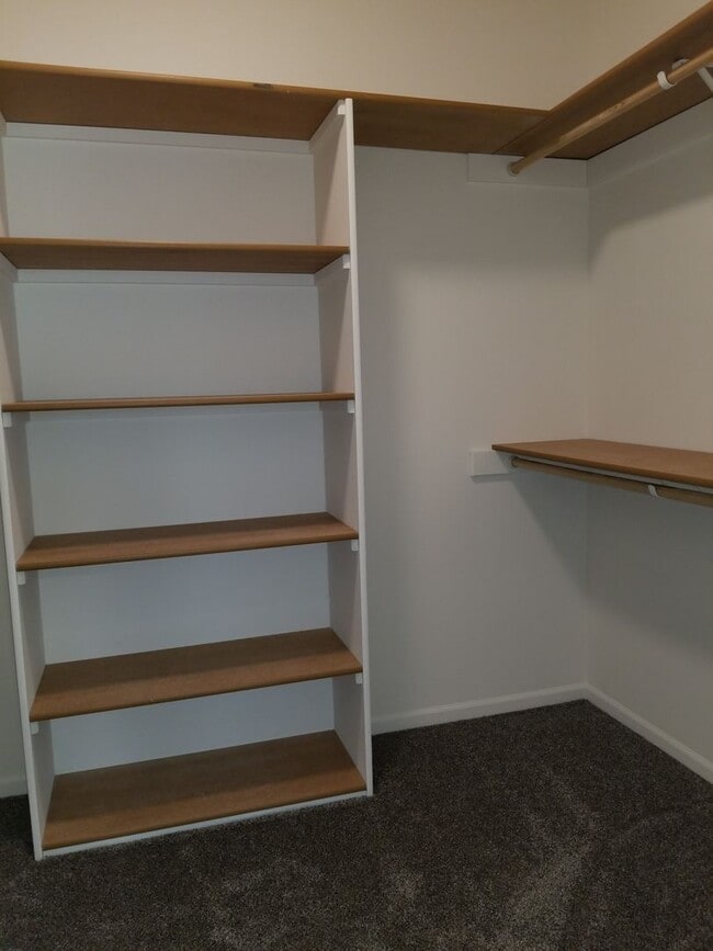 Building Photo - Daylight ranch townhome with 2 stall garage.  Private driveway and covered deck. high end finishe...