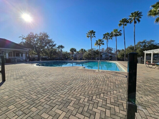 Building Photo - Beautiful 2BR/2BA Condo in Sunset Lakes – Lake & Tree Views!