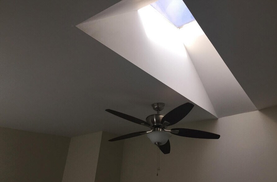 Master bedroom's vaulted ceiling, skylight, and fan - 900 South Paca Street