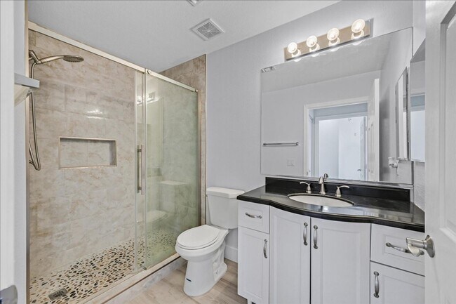Building Photo - Top level 2 bedroom condo located in guard...