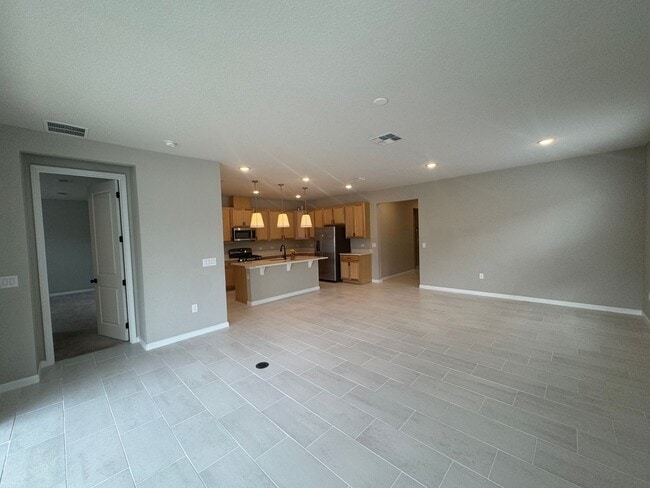 Building Photo - Where Modern Comfort Meets 4BD/3BA Hometown Charm — Your Story Begins in Okahumpka! FULLY-FENCED!...