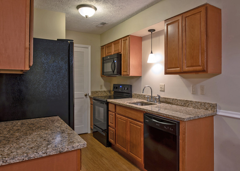 Newly remodeled two-bedroom kitchen - Cedarstone Apartments