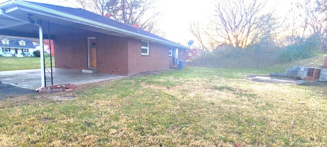 Building Photo - HALF OFF FIRST MONTH RENT! Single family brick home with full unfinished bsmt & detached garage