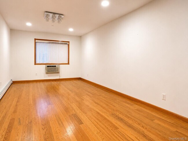Building Photo - 65-44 Woodside Ave